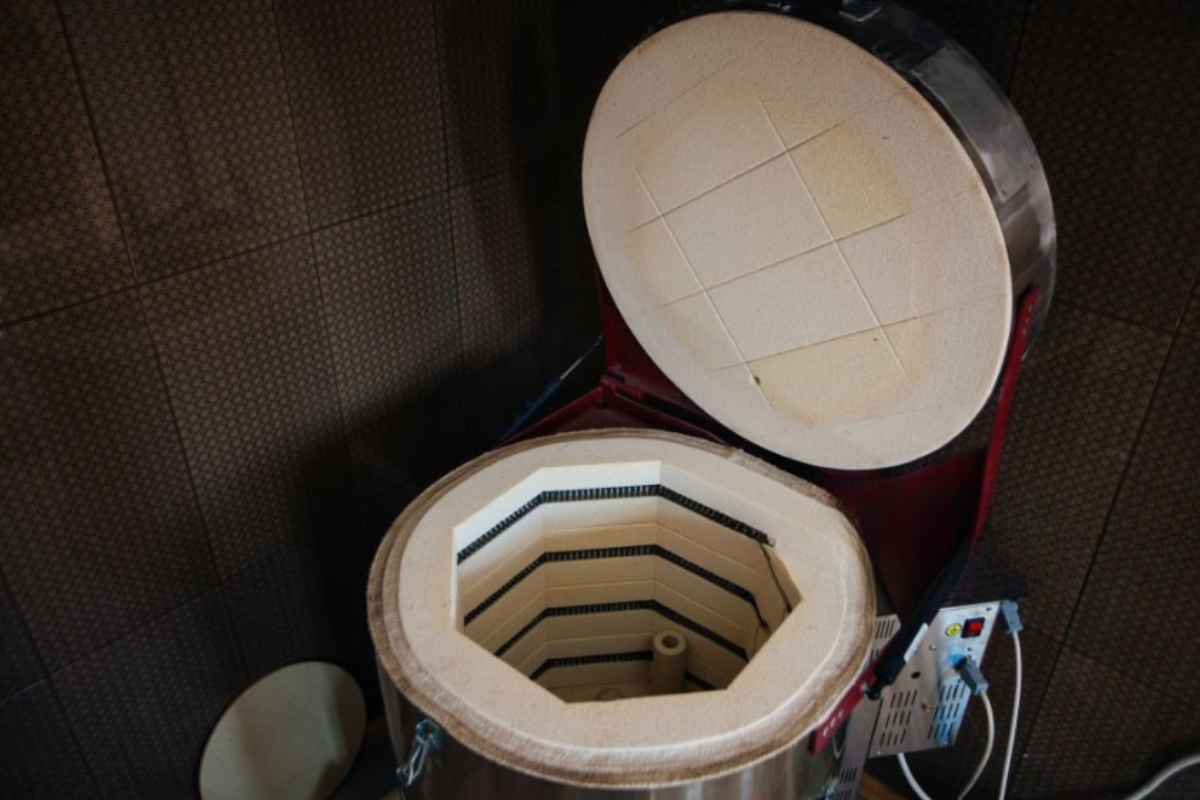 Home kiln installation setup in a garage with proper clearance and ventilation